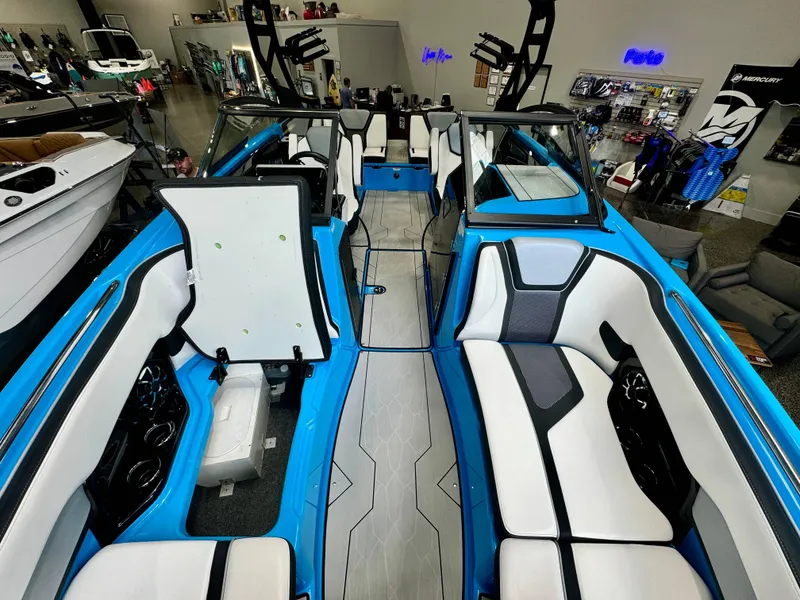 Slide: The Image of Interior view of 2022 Yamaha Boats 255XD, featuring sleek blue and white seating. - 9