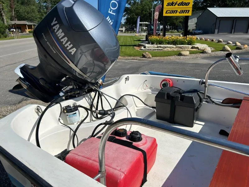 Slide: The Image of 1982 Boston Whaler Sport 15 with Yamaha outboard motor and fuel tank. - 5