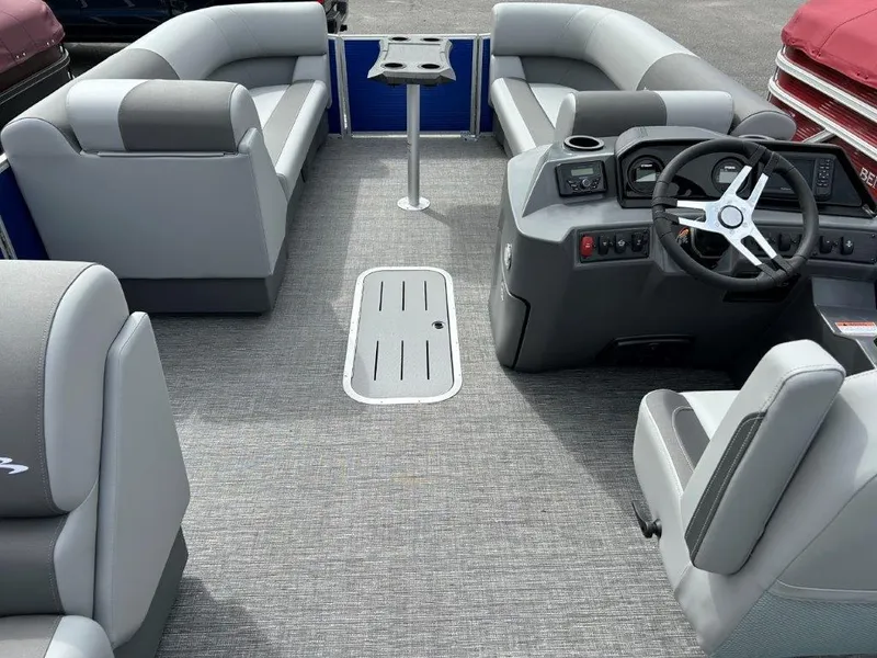 Slide: The Image of 2024 Bennington 20SVSRSPS pontoon boat interior with gray seating and modern helm. - 6