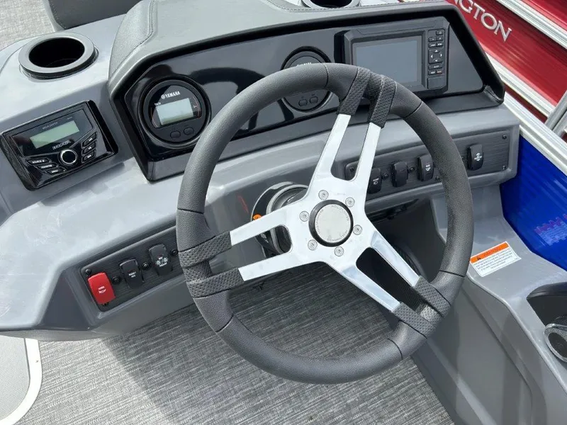 Slide: The Image of 2024 Bennington 20SVSRSPS boat dashboard with steering wheel and control panel. - 7