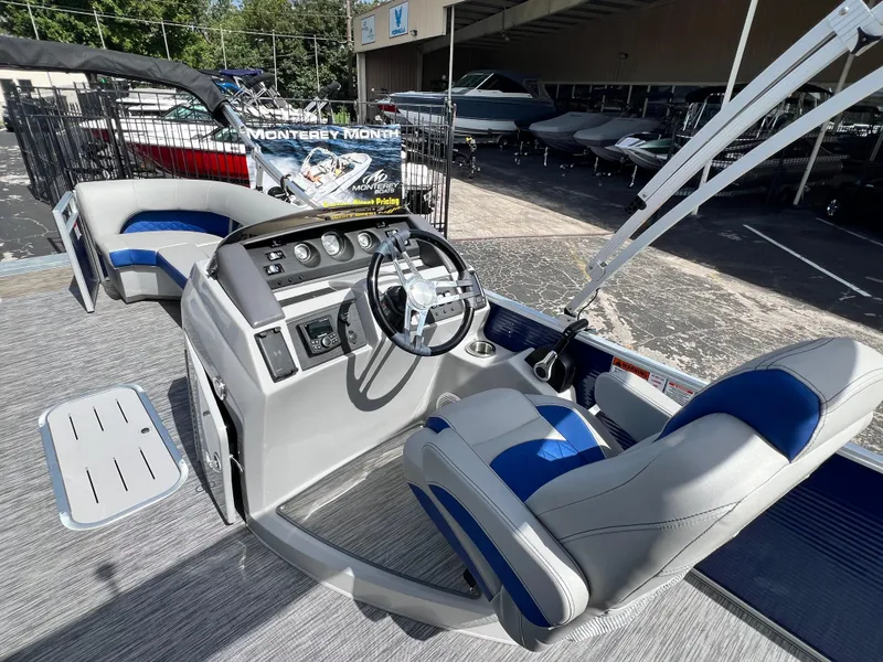 Slide: The Image of 2022 Bennington 23LSB boat interior with modern helm and seating. - 11
