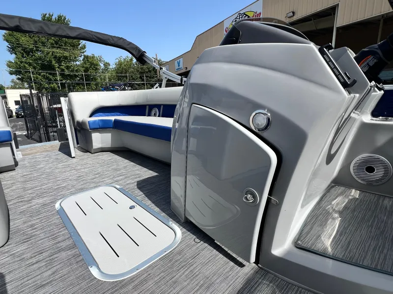 Slide: The Image of 2022 Bennington 23LSB boat interior with sleek gray and blue seating, modern design. - 13