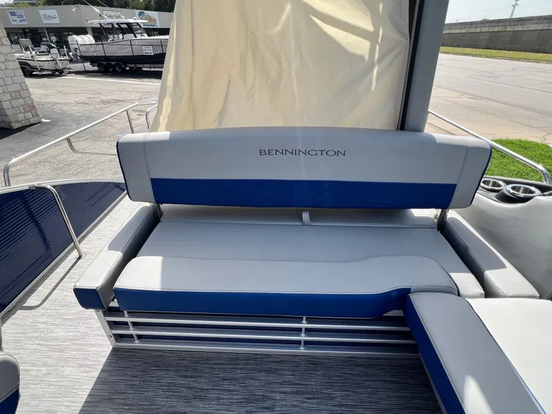 Slide: The Image of 2022 Bennington 23LSB boat interior with blue and gray seating. - 9