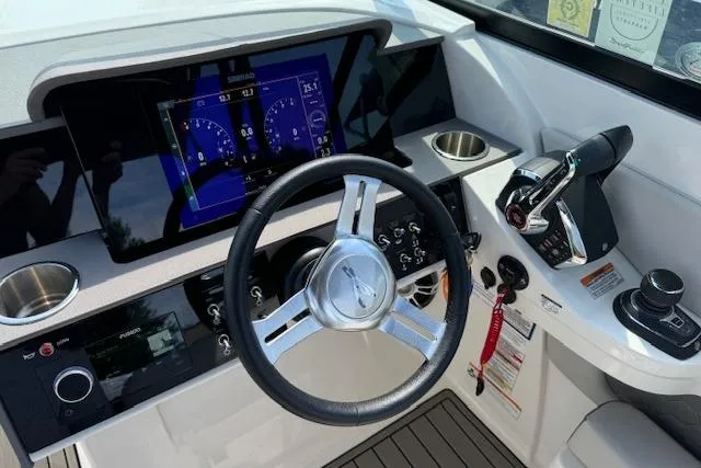 Slide: The Image of 2023 Sea Ray SDX 290 Outboard helm with modern controls and digital display. - 10