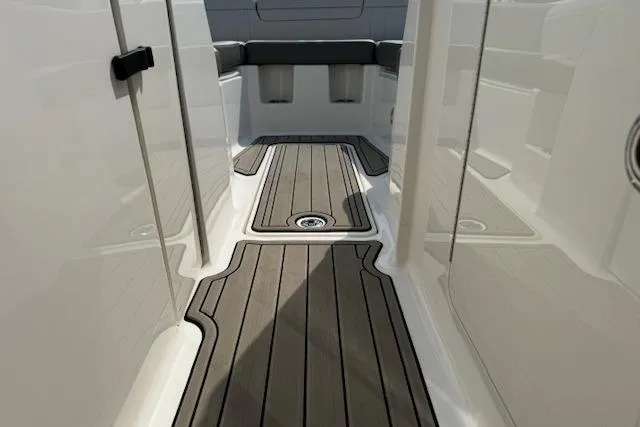 Slide: The Image of 2023 Sea Ray SDX 290 Outboard interior with sleek deck design and seating area. - 15