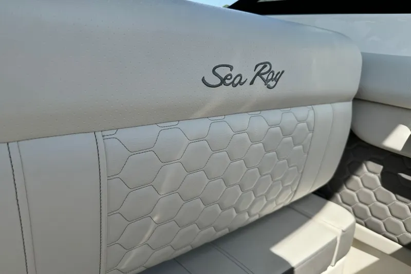 Slide: The Image of 2023 Sea Ray SDX 290 Outboard boat seat with hexagonal pattern and logo. - 17