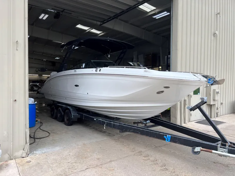 Slide: The Image of 2023 Sea Ray SDX 290 Outboard boat on trailer in storage facility. - 3