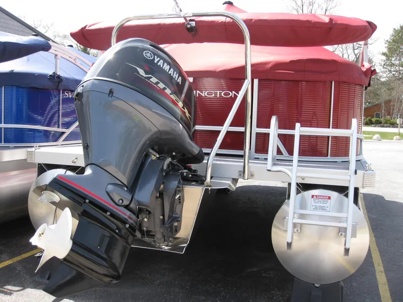 Slide: The Image of 2024 Bennington 20SVSRSR pontoon boat with Yamaha outboard motor, red canopy. - 3
