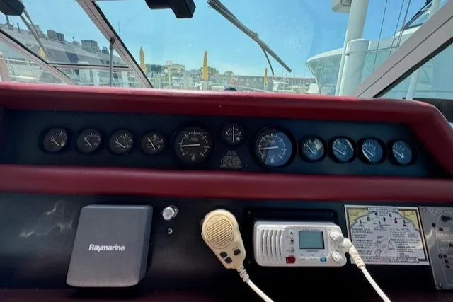 Slide: The Image of Control panel of a 1990 Sea Ray 350 Sundancer boat with gauges and navigation equipment. - 10