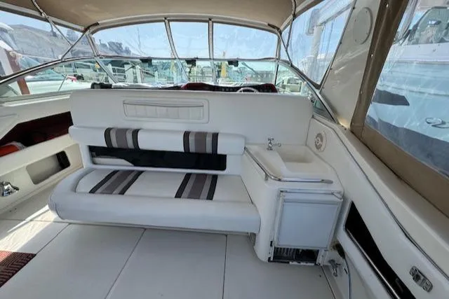 Slide: The Image of Interior of 1990 Sea Ray 350 Sundancer boat with seating and storage. - 18