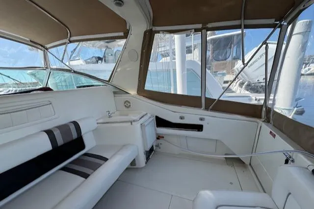 Slide: The Image of Interior of 1990 Sea Ray 350 Sundancer yacht with seating and windows. - 3