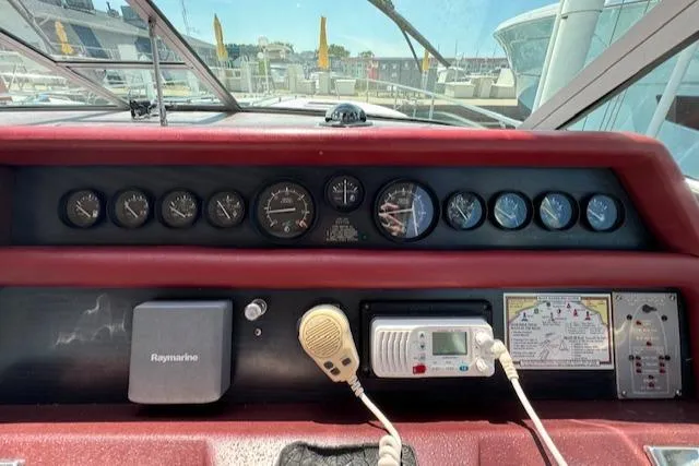 Slide: The Image of Control panel of a 1990 Sea Ray 350 Sundancer boat with gauges and navigation equipment. - 6