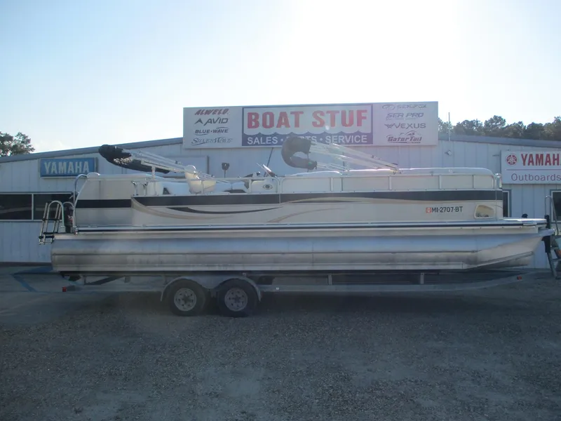 Slide: The Image of 2007 Avalon Excalibur 27' pontoon boat on trailer at dealership. - 0