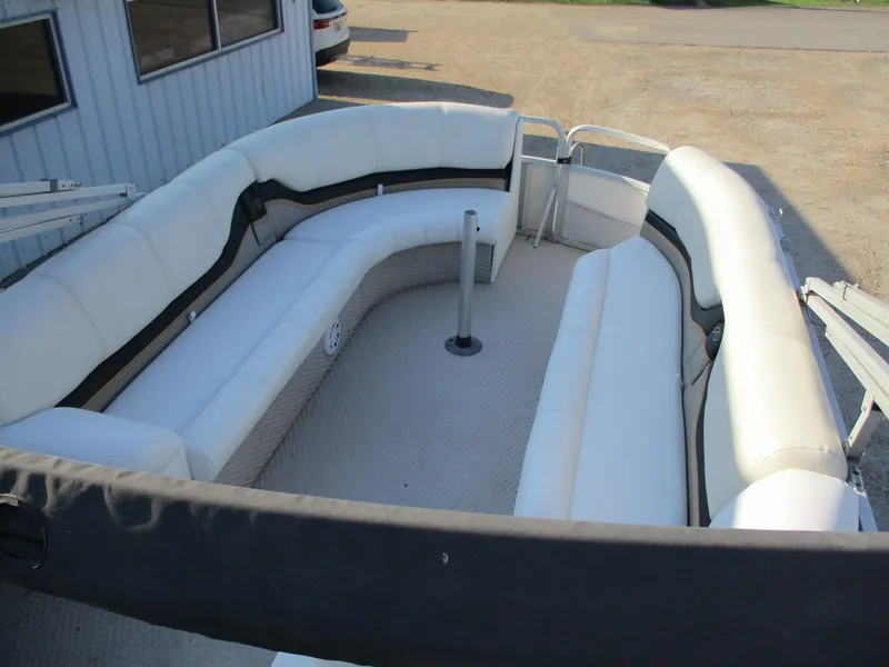 Slide: The Image of 2007 Avalon Excalibur 27' boat interior with white seating and open deck layout. - 11