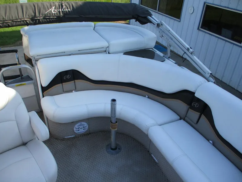 Slide: The Image of Luxurious seating on 2007 Avalon Excalibur 27' boat with white upholstery. - 13