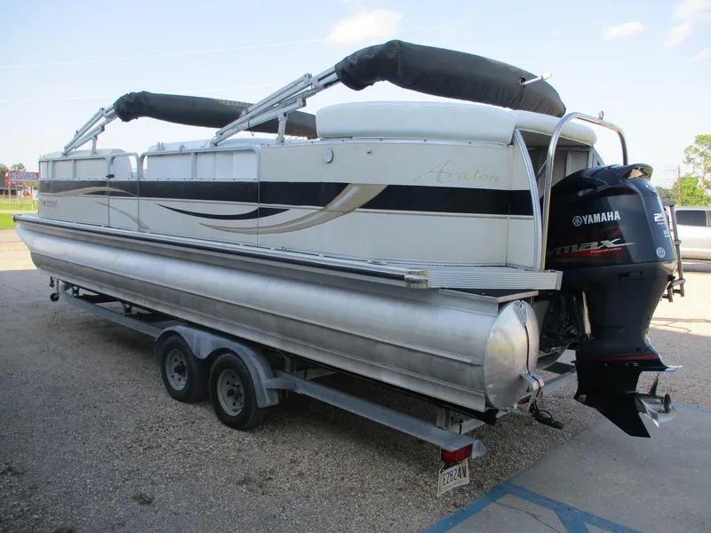 Slide: The Image of 2007 Avalon Excalibur 27' pontoon boat on trailer with Yamaha outboard motor. - 2