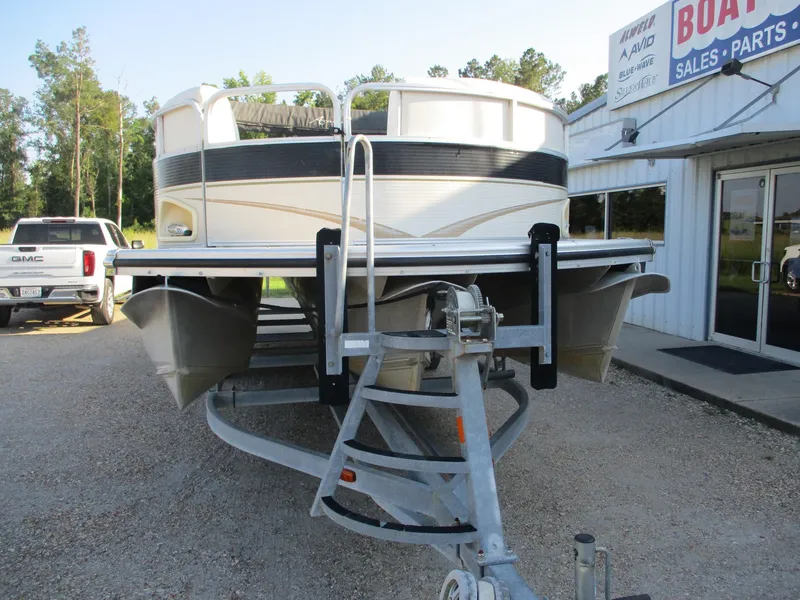 Slide: The Image of 2007 Avalon Excalibur 27' pontoon boat on trailer at dealership. - 4
