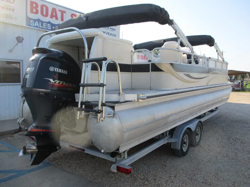 Slide: The Image of 2007 Avalon Excalibur 27' pontoon boat with Yamaha outboard motor on trailer. - 6