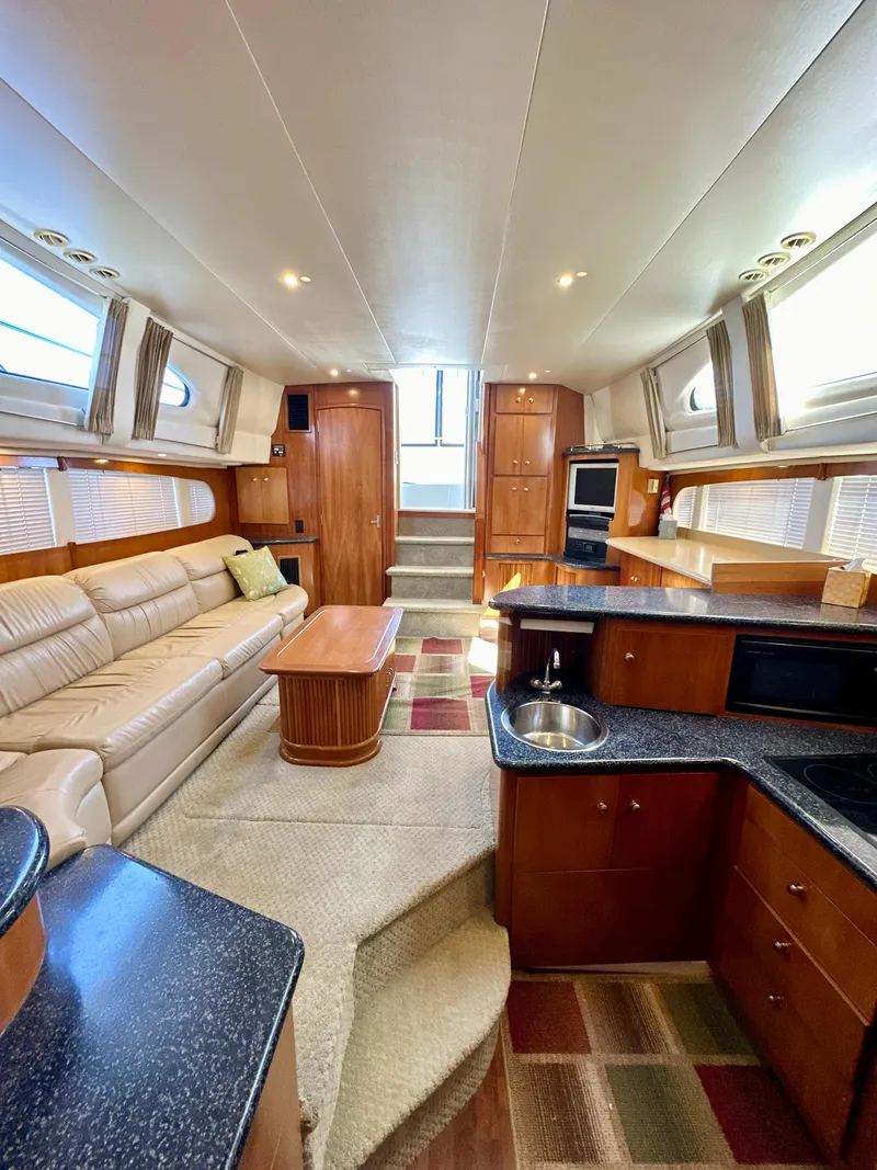 Slide: The Image of Interior of 2000 Carver 396 Motor Yacht with modern furnishings and spacious layout. - 26