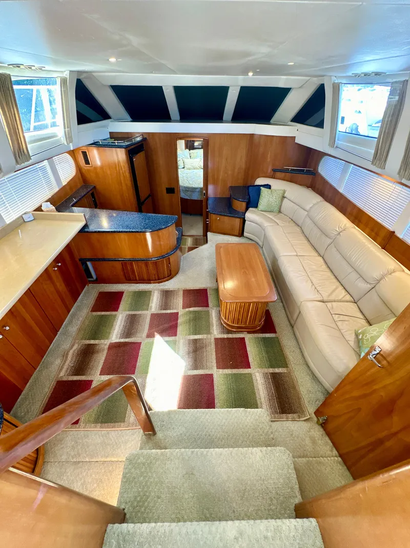 Slide: The Image of Interior of 2000 Carver 396 Motor Yacht with modern furnishings and spacious layout. - 13
