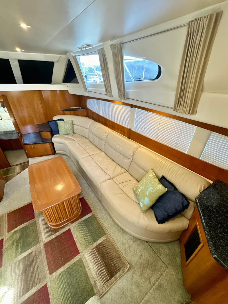 Slide: The Image of Interior of 2000 Carver 396 Motor Yacht with plush seating and modern decor. - 15