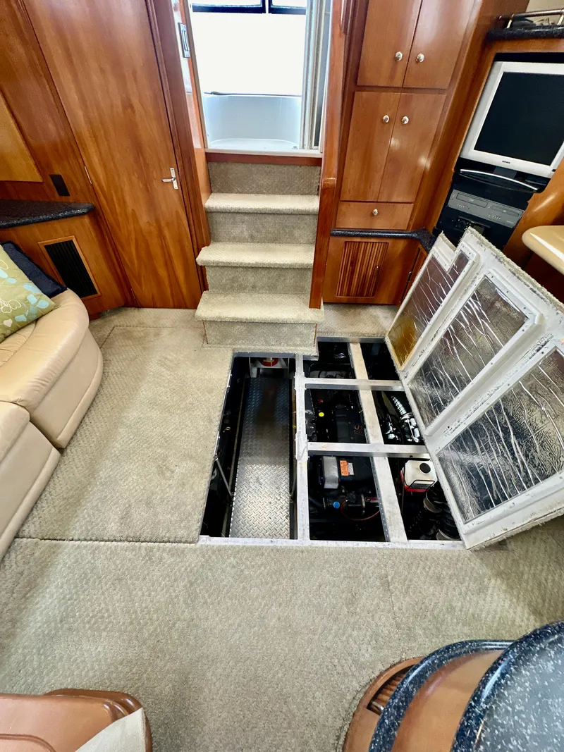 Slide: The Image of Interior of 2000 Carver 396 Motor Yacht with open engine access panel. - 32