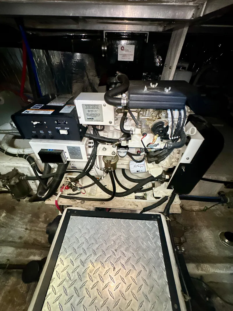 Slide: The Image of Engine room of 2000 Carver 396 Motor Yacht with visible machinery and components. - 34