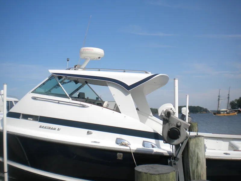 Slide: The Image of 1968 Bertram 31 Bahia Mar boat docked by the water on a sunny day. - 2