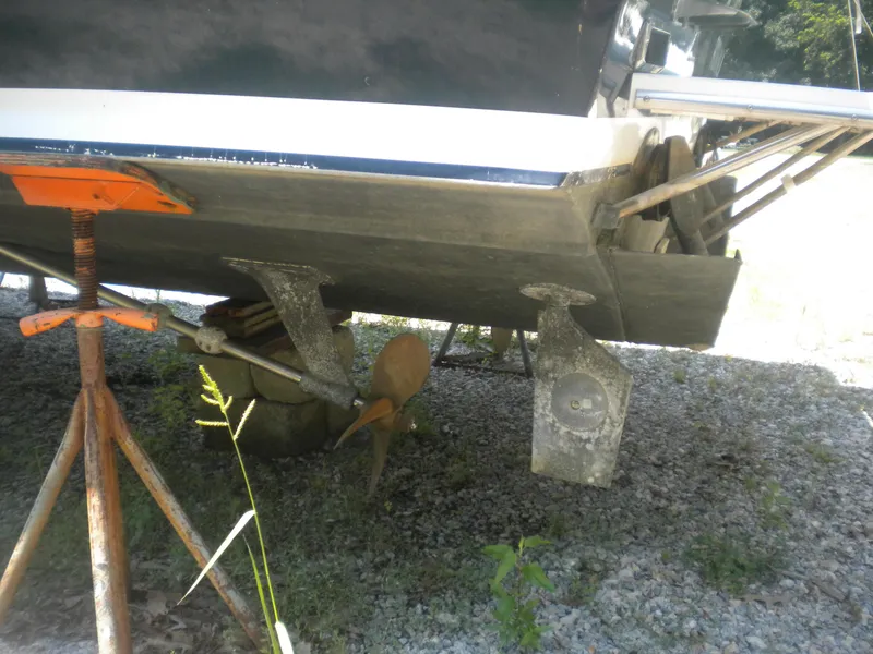 Slide: The Image of 1968 Bertram 31 Bahia Mar boat on stands, showing propeller and hull details. - 42