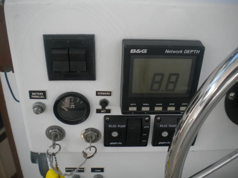 Slide: The Image of Control panel of a 1968 Bertram 31 Bahia Mar boat with depth gauge and switches. - 6