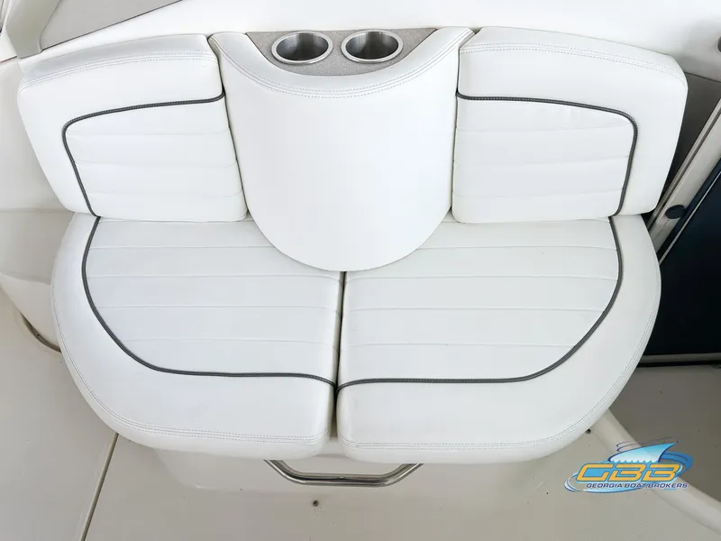 Slide: The Image of White leather seating with cup holders on 2006 Sea Ray 290 Sundancer boat. - 13