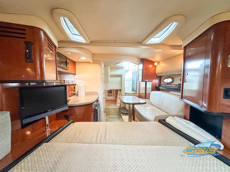 Slide: The Image of Interior of 2006 Sea Ray 290 Sundancer yacht with cozy seating and modern amenities. - 24