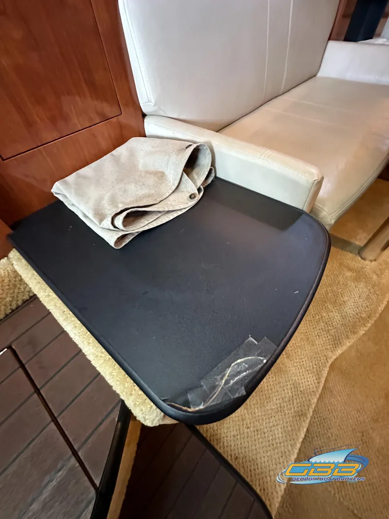 Slide: The Image of Interior of 2006 Sea Ray 290 Sundancer with table and seating area. - 34