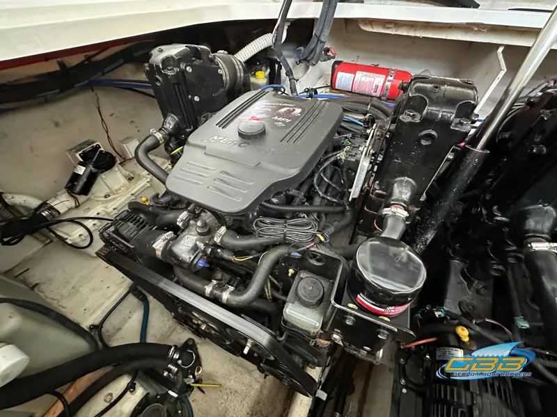 Slide: The Image of Engine compartment of a 2006 Sea Ray 290 Sundancer boat, featuring detailed components. - 44