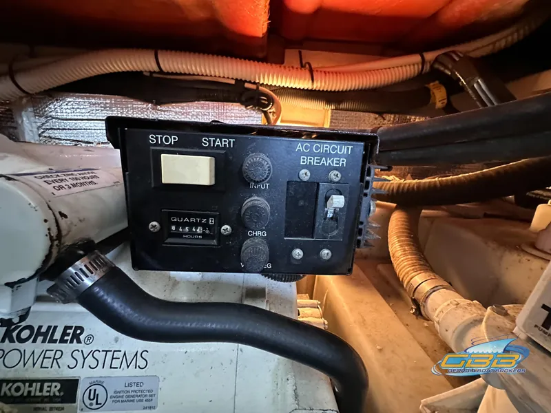 Slide: The Image of Control panel of a 2006 Sea Ray 290 Sundancer boat with Kohler power systems. - 46