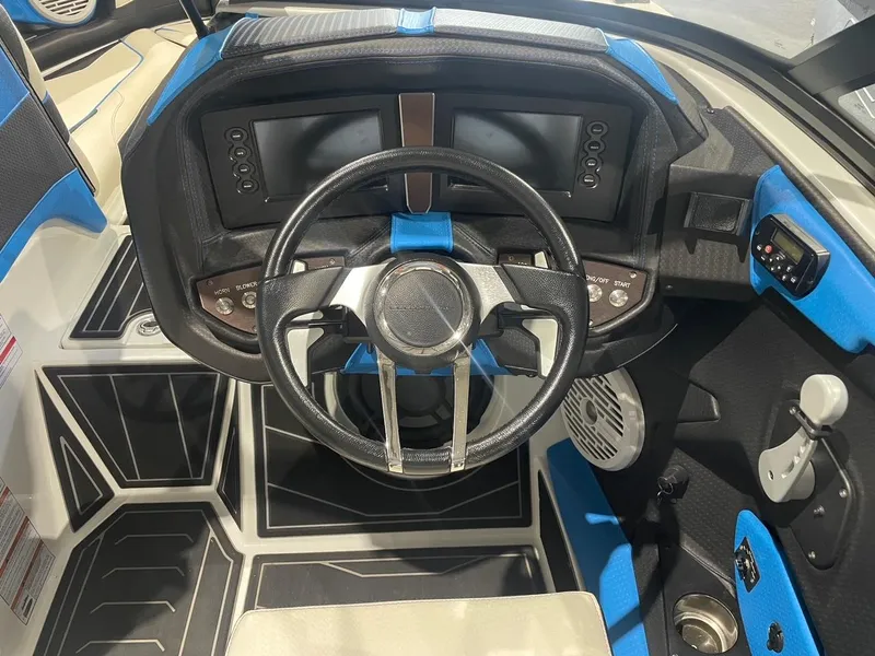 Slide: The Image of 2020 Centurion Ri237 boat dashboard with modern controls and blue accents. - 6