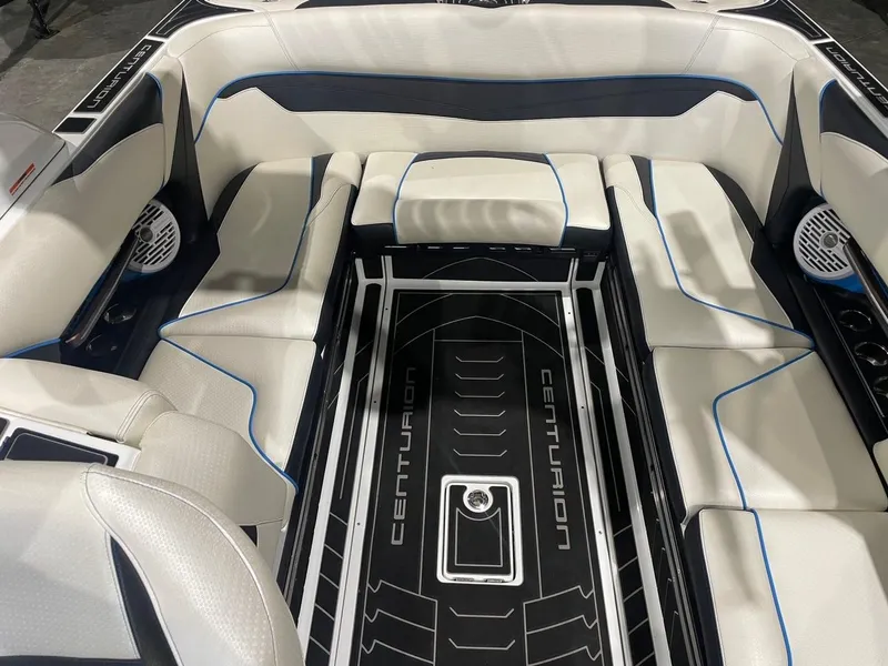 Slide: The Image of 2020 Centurion Ri237 boat interior with white seating and black accents. - 9