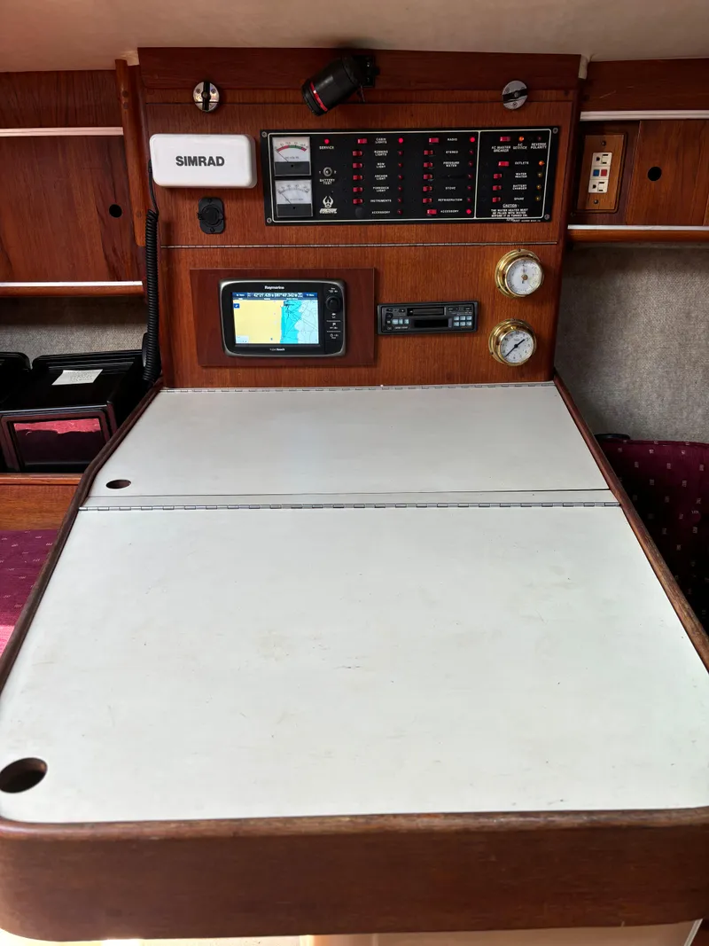 Slide: The Image of Navigation station on 1989 Ericson Yachts 34 with Simrad equipment and control panel. - 16
