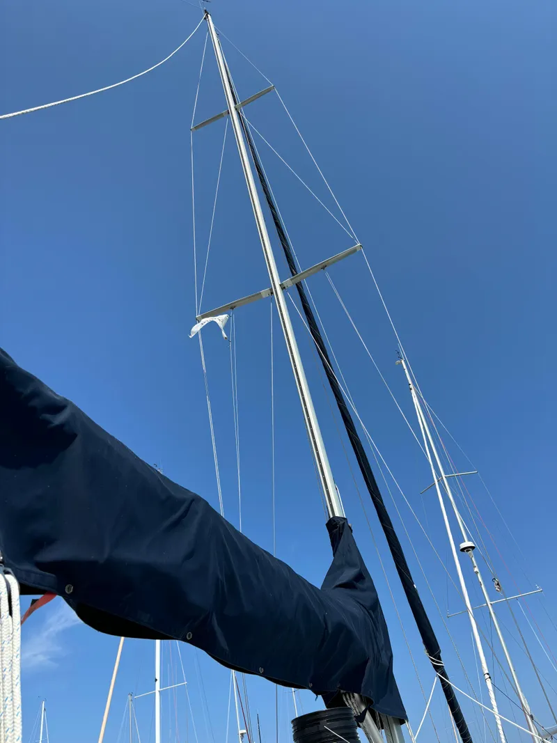 Slide: The Image of Ericson Yachts 34 sailboat mast against clear blue sky, 1989 model. - 24