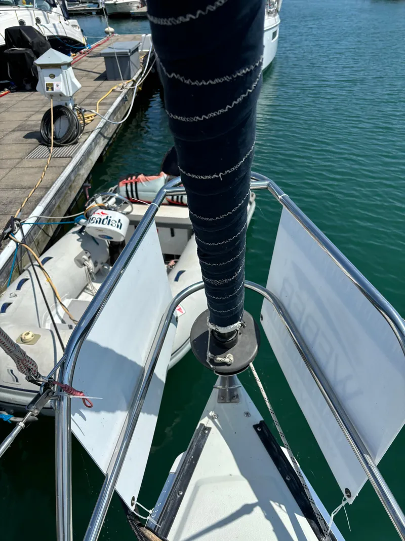 Slide: The Image of Bow view of 1989 Ericson Yachts 34 docked at marina. - 5