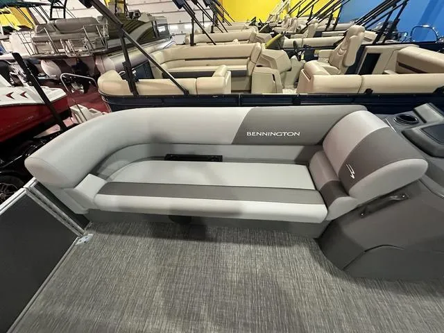 Slide: The Image of 2025 Bennington 21 SL pontoon boat interior with gray seating and modern design. - 13