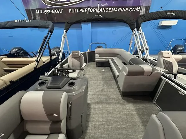 Slide: The Image of 2025 Bennington 21 SL pontoon boat interior with gray seating and modern design. - 14