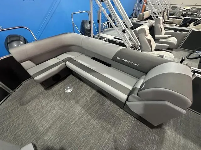 Slide: The Image of 2025 Bennington 21 SL pontoon boat with gray seating and modern design. - 8