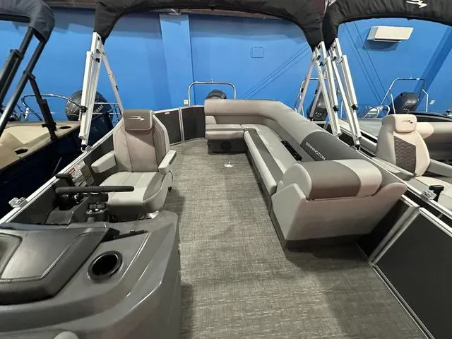 Slide: The Image of 2025 Bennington 21 SL pontoon boat interior with gray seating and modern design. - 9