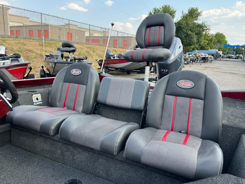 Slide: The Image of 2016 Ranger RT 178 Tournament edition boat seats with red accents in outdoor setting. - 11