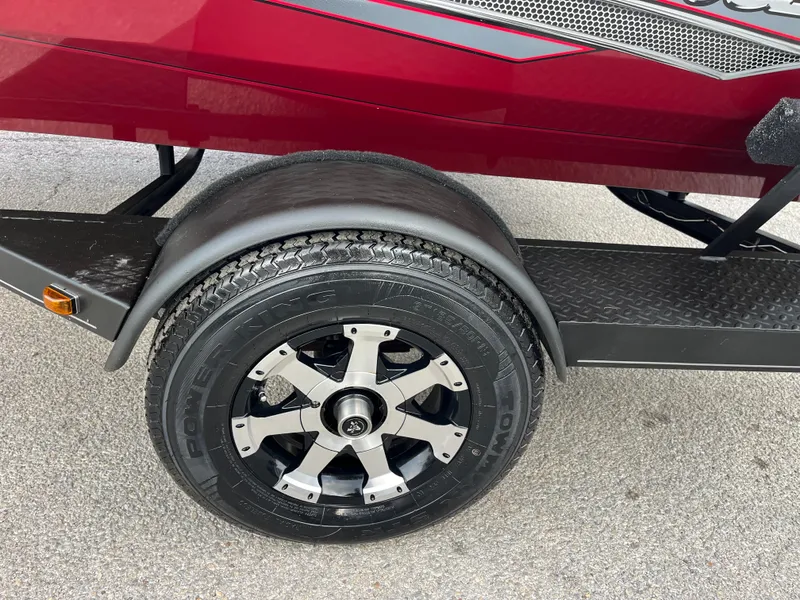 Slide: The Image of 2016 Ranger RT 178 Tournament edition trailer wheel, black and silver rim, red boat detail. - 15