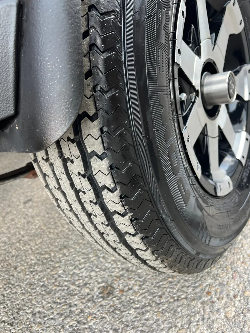 Slide: The Image of Close-up of 2016 Ranger RT 178 Tournament edition tire and wheel on pavement. - 16