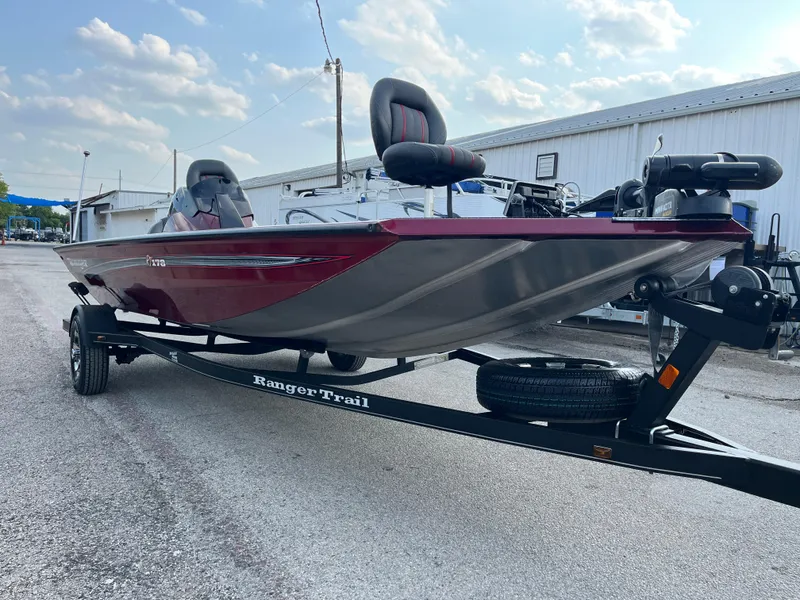 Slide: The Image of 2016 Ranger RT 178 Tournament Edition boat on trailer, parked outdoors. - 29