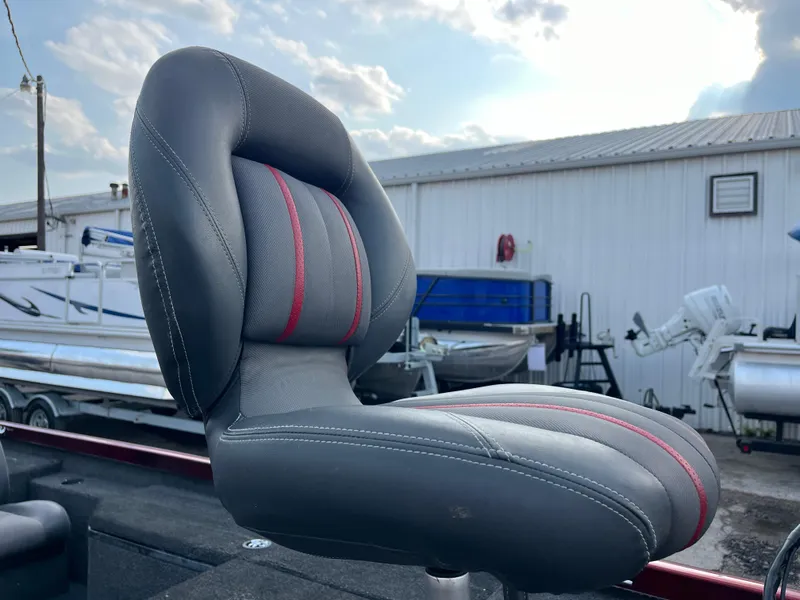 Slide: The Image of 2016 Ranger RT 178 Tournament edition boat seat with red accents, outdoor setting. - 32