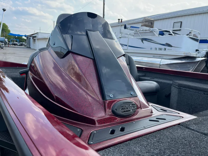 Slide: The Image of 2016 Ranger RT 178 Tournament Edition boat, maroon finish, docked near other vessels. - 33
